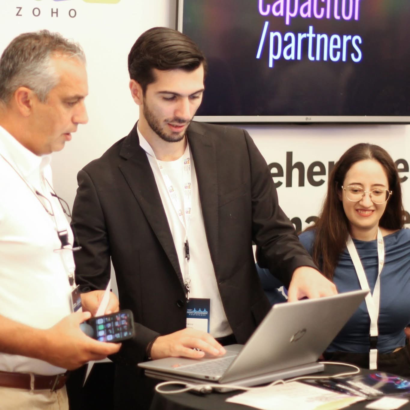 Capacitor Partners team demonstrating Zoho Projects at the 9th Project Management Conference in Nicosia